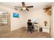 Bedroom with a ceiling fan, a window with blinds, and a small office area at 112 Forest Cir, Safety Harbor, FL 34695