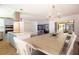 Open-concept kitchen and dining area with stainless appliances, quartz countertops and tile floors at 112 Forest Cir, Safety Harbor, FL 34695