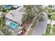 This aerial view highlights the property's well-maintained landscaping and screened-in pool at 11308 Pocket Brook Dr, Tampa, FL 33635