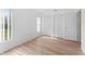 Bright bedroom featuring light wood flooring and a large closet at 11308 Pocket Brook Dr, Tampa, FL 33635