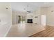 Spacious living room featuring a fireplace, tile flooring, ceiling fan, and sliding glass doors to the pool at 11308 Pocket Brook Dr, Tampa, FL 33635