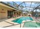 Screened in pool area with a tiki bar and jacuzzi at 11308 Pocket Brook Dr, Tampa, FL 33635