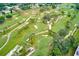 Expansive aerial view of a lush golf course with winding paths and mature trees at 12200 Vonn Rd # 1305, Largo, FL 33774