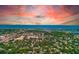 Expansive aerial view of a coastal community with vibrant foliage and stunning ocean scenery at 12200 Vonn Rd # 1305, Largo, FL 33774