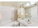 Well-lit bathroom features a shower-tub combo, a toilet, and a vanity at 12200 Vonn Rd # 1305, Largo, FL 33774