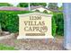 Villas Capri is a welcoming 55+ community shown on this sign surrounded by lush greenery at 12200 Vonn Rd # 1305, Largo, FL 33774