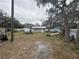 Spacious backyard with boat, shed, and bordered by mature trees at 12205 Greenland Dr, Riverview, FL 33579