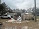 Exterior view of a house with covered porch, shed, truck, and mature trees at 12205 Greenland Dr, Riverview, FL 33579