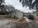 Exterior view of the home featuring siding and a well-maintained lawn and ample parking at 12205 Greenland Dr, Riverview, FL 33579