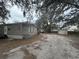 Exterior view of the home, featuring neutral siding and a well-maintained yard at 12205 Greenland Dr, Riverview, FL 33579