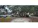 Charming single-story home with mature trees, a large lot, and ample parking at 12205 Greenland Dr, Riverview, FL 33579