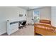 Bedroom with light-colored carpet, a wooden bed frame, desk and furniture and a window at 12239 Fawn Brindle St, Riverview, FL 33578