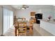 Cozy dining room with wooden table, chairs, and plenty of natural light at 12239 Fawn Brindle St, Riverview, FL 33578