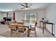 Bright dining area with a wooden table and chairs, and a view of the backyard at 12239 Fawn Brindle St, Riverview, FL 33578