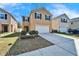 Two-story home with a front lawn and a two-car garage under a bright, blue sky at 12239 Fawn Brindle St, Riverview, FL 33578