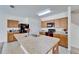 Well-equipped kitchen featuring ample counter space, stainless steel appliances, and natural wood cabinets at 12239 Fawn Brindle St, Riverview, FL 33578