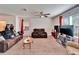 Relaxing living room showcasing plush seating, a ceiling fan, and natural light at 12239 Fawn Brindle St, Riverview, FL 33578