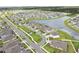 An aerial shot of a suburban neighborhood with many houses and a lake. A view of an organized community at 12829 Tortoise Shell Pl, Riverview, FL 33579