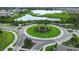 Aerial view of a well-maintained community roundabout with lush greenery at 12829 Tortoise Shell Pl, Riverview, FL 33579