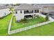 Aerial view of a fenced backyard featuring a covered patio on two levels with plenty of space for outdoor seating at 12829 Tortoise Shell Pl, Riverview, FL 33579