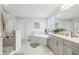 Bright bathroom featuring a shower, tub, and double sink with a white countertop at 12829 Tortoise Shell Pl, Riverview, FL 33579