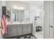 Elegant bathroom with a glass-enclosed shower, dual vanity, and modern finishes at 12829 Tortoise Shell Pl, Riverview, FL 33579