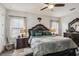 A large bedroom featuring ornate wood furniture and decor, including a decorative headboard at 12829 Tortoise Shell Pl, Riverview, FL 33579