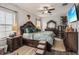 A large bedroom featuring ornate wood furniture and decor, including a decorative headboard at 12829 Tortoise Shell Pl, Riverview, FL 33579