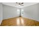 Bedroom featuring hardwood floors, ceiling fan and natural lighting at 13128 Hazelcrest St, Spring Hill, FL 34609