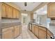 Eat-in kitchen design showcasing tile floors, granite counters and stainless appliances at 13128 Hazelcrest St, Spring Hill, FL 34609