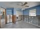 Bright bedroom featuring terrazzo floors and abundant natural light from large windows at 13313 2Nd E St, Madeira Beach, FL 33708