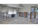 Spacious living room with exposed block walls, ceiling fan and natural light at 13313 2Nd E St, Madeira Beach, FL 33708