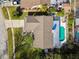 Overhead view of a home highlighting the pool, backyard landscaping, and extended patio area at 15109 Winterwind Dr, Tampa, FL 33624