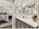 Bathroom featuring vanity with stone countertop, under-mount sink and modern fixtures at 15109 Winterwind Dr, Tampa, FL 33624