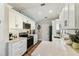 Modern kitchen with stainless steel appliances, white cabinets, quartz countertops, and a subway tile backsplash at 15109 Winterwind Dr, Tampa, FL 33624