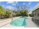 Backyard pool with mature trees at 15109 Winterwind Dr, Tampa, FL 33624