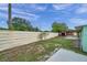 View of backyard featuring an adjacent shed and a tall fence for privacy at 1530 Clair Mel Cir, Tampa, FL 33619