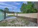 View of the backyard with a concrete patio and partial fencing at 1530 Clair Mel Cir, Tampa, FL 33619