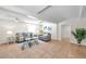 Bright living room featuring tile flooring, ceiling fans, and neutral decor, creating a welcoming and comfortable space at 1530 Clair Mel Cir, Tampa, FL 33619