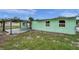 View of a shed featuring a concrete pad, adjacent to the home at 1530 Clair Mel Cir, Tampa, FL 33619