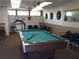 Fun game room featuring a pool table, dart boards, and seating for entertainment at 18675 Us Highway 19 N # 320, Clearwater, FL 33764