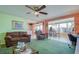 Spacious living room with ample seating, an adjacent dining area, and plenty of natural light at 18675 Us Highway 19 N # 320, Clearwater, FL 33764