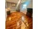 Bedroom featuring wood floors, neutral paint, and a ceiling fan at 18840 Rustic Woods Trl, Odessa, FL 33556