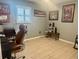 Bedroom displaying office furniture, tile floors, and posters of Tampa sports teams at 18840 Rustic Woods Trl, Odessa, FL 33556