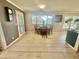 Dining area featuring table and chairs, natural lighting, and tile flooring at 18840 Rustic Woods Trl, Odessa, FL 33556