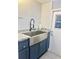 Modern kitchen corner featuring a stainless steel farmhouse sink, granite countertops, and subway tile backsplash at 18840 Rustic Woods Trl, Odessa, FL 33556