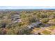 Expansive aerial shot showcasing the neighborhood's tree-lined streets and proximity to waterfront at 2008 Harvard Ave, Dunedin, FL 34698