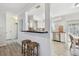 Open-concept space with bar stool seating facing the kitchen at 2008 Harvard Ave, Dunedin, FL 34698