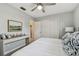 Bedroom showcasing light gray walls, wood-look flooring, and natural light through the window at 2008 Harvard Ave, Dunedin, FL 34698