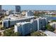 High-angle view of gray condo building at One Laurel Place in an urban setting, with rooftop parking at 201 W Laurel St # 507, Tampa, FL 33602